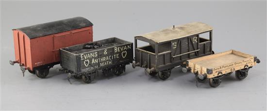 An Evans and Bevan open wagon with load, no.4107, in black, a Portland Stone, no.89, a guards van SR, no. 7960,